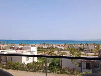 a view of the beach from the balcony of a condo at Mesca Chalet Soma Bay in Hurghada