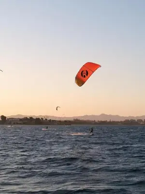 a person flying a kite in the water at Studio Serenity Downtown El Gouna in Hurghada