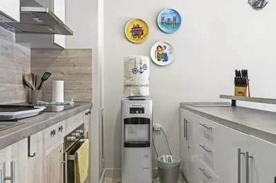 a kitchen with a cake on top of a refrigerator at Luxurious private Getaway in Mangroovy in Hurghada