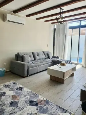 a living room with a couch and a coffee table at Bali D-28 in Hurghada