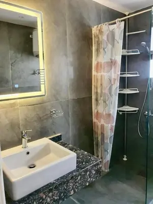 a bathroom with a sink and a shower at Bali D-28 in Hurghada
