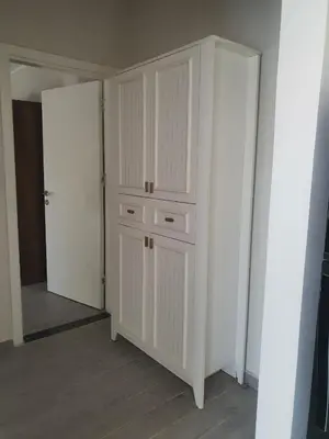a white closet with white cabinets in a room at Bali D-28 in Hurghada