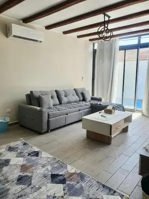 a living room with a couch and a coffee table at Bali D-28 in Hurghada
