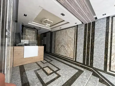 a room with a lobby with a wall of windows at Elamer building in Hurghada