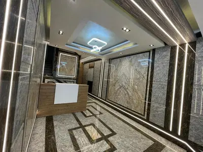 a bathroom with a sink and a glass wall at Elamer building in Hurghada