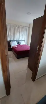a bedroom with a bed in a room with a window at Zahabia Golden Beach Resort Down Town in Hurghada