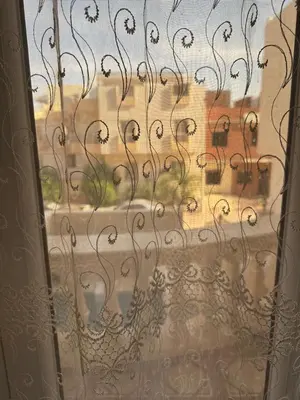 a window with a view of a street at Tulip residence villa 1 in Hurghada