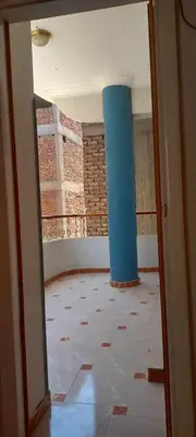 an empty room with a blue pillar and a floor at Villa Rose - Luxor in Luxor
