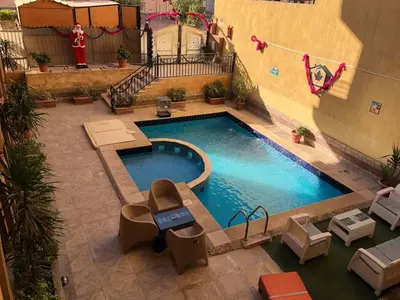 an overhead view of a swimming pool in a building at Golden key in Hurghada