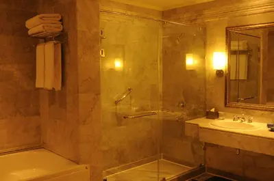 a bathroom with a shower and a sink at HRG Best Hotel in Hurghada