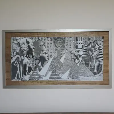 a framed picture of ancientgyptian art on a wall at Tiba Golden Beach Resort, Down Town in Hurghada