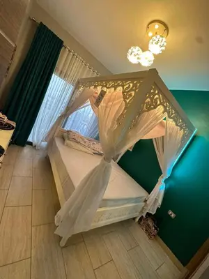 a bedroom with a bed with a canopy at Super luxury hotel apartment in Hurghada