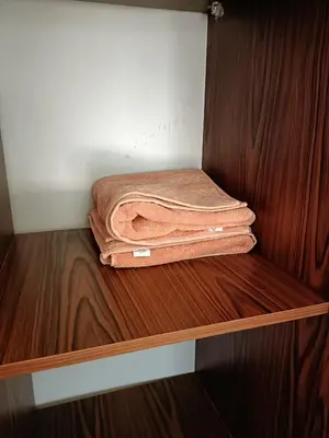 a couple of towels are sitting on a shelf at شاليه ميراج باى in Hurghada