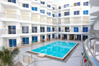 anterior view of a building with a swimming pool at Daily rent studio pool view in Hurghada