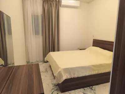 a small bedroom with a bed and a window at New 2bedroom apartment 7 min drive from Sheraton in Hurghada