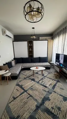 a living room with a couch and a table at Mackdi hights in Hurghada