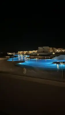 a group of blue lights in a parking lot at night at Mackdi hights in Hurghada