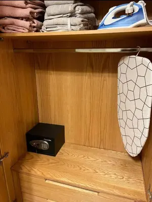 a wooden closet with a drawer with a speaker in it at M8 free access to the BEACH and POOL in Hurghada