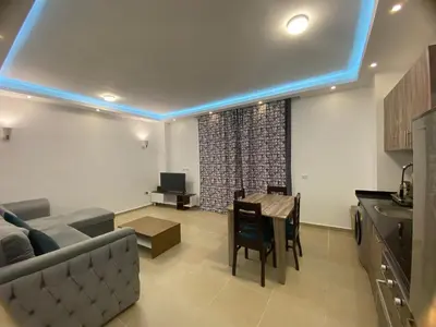 a living room with a couch and a table at Andreas Residence in Hurghada