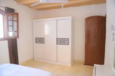 a room with a closet and a door at Karma house in Luxor
