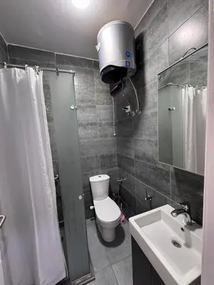 a bathroom with a toilet and a sink and a mirror at Imperial resort Hurgarda in Hurghada