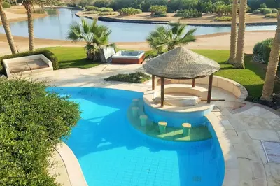 an overhead view of a swimming pool with a gazebo at Private Villa with heated pool and lagoon in Hurghada