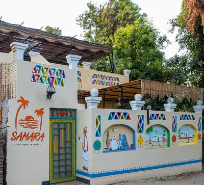 a house with a mural on the side of it at Samara Guest House in Aswan