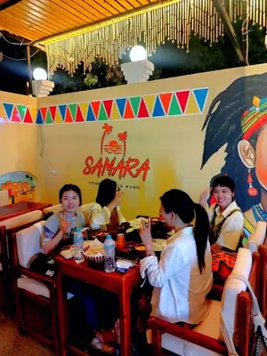 a group of children sitting at a table in a restaurant at Samara Guest House in Aswan