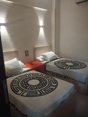 two beds sitting next to each other in a room at City center NewAswan Aswan 2 in Aswan