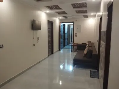 a living room with a couch and a tv on a wall at City center NewAswan Aswan 2 in Aswan