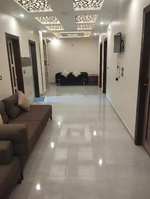 a large living room with couches and a television at City center NewAswan Aswan 2 in Aswan