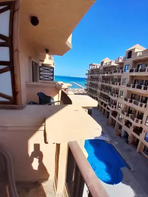 a view of the ocean from the balcony of a hotel at Turtles Beach resort hourghada Studio view sea view pool private beach jacuzzi pools air-conditioned restaurant on the beach jacuzzi security and a large sunny balcony in Hurghada