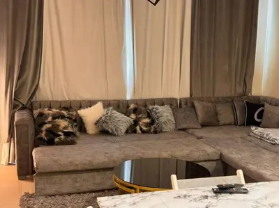 a couch with pillows on it in a living room at Amazing Mangroovy 1 BD in gouna in Hurghada