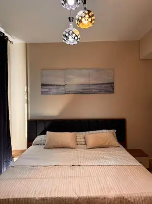 a bedroom with a large bed with two pillows at Amazing Mangroovy 1 BD in gouna in Hurghada