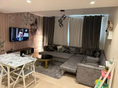 a living room with a couch and a table at Amazing Mangroovy 1 BD in gouna in Hurghada