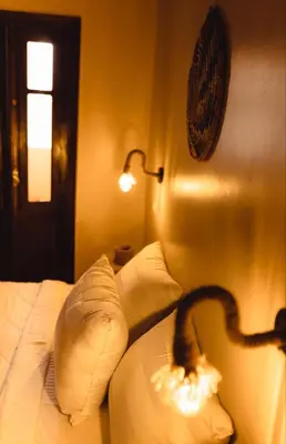 a snake on the pillows of a bed in a bedroom at Wanees Hostel in Aswan