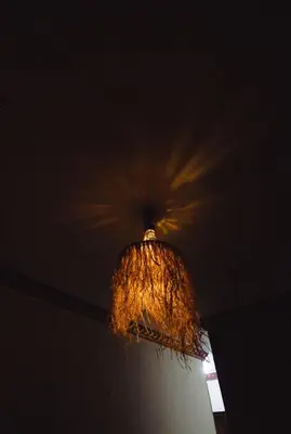 a chandelier hanging from the ceiling in a room at Wanees Hostel in Aswan