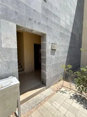 an entrance to a building with a concrete wall at Peaceful 1BR studio at G-Crib El Gouna in Hurghada