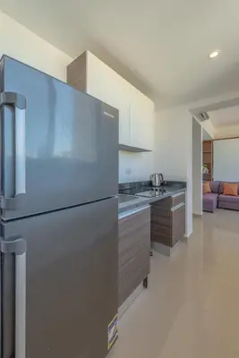 a kitchen with a stainless steel refrigerator at Peaceful 1BR studio at G-Crib El Gouna in Hurghada