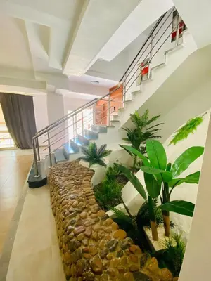 a room with a staircase with plants and a stone path at Hurghada-Magawish Villa 5 in Hurghada