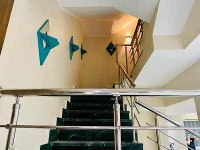 a staircase with blue stars on the wall at Hurghada-Magawish Villa 5 in Hurghada