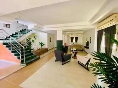 a lobby with a staircase and a living room at Hurghada-Magawish Villa 5 in Hurghada