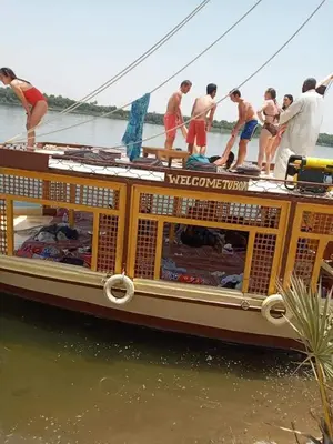 a group of people on a boat in the water at Relaxing Felucca Trips in Aswan