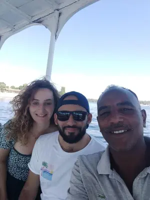 a group of people on a boat in the water at Relaxing Felucca Trips in Aswan