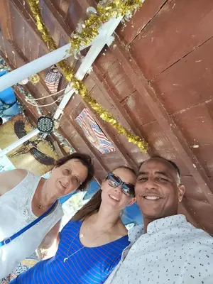 a group of three people posing for a picture at Relaxing Felucca Trips in Aswan