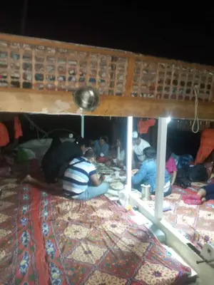 a group of people sitting on the floor under a bed at Relaxing Felucca Trips in Aswan