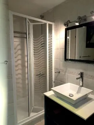 a bathroom with a shower and a white sink at The view hurghada in Hurghada