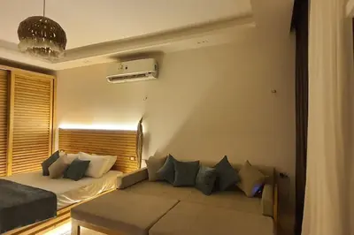 a living room with a bed and a couch at Studio in Selena Bay Hurghada in Hurghada