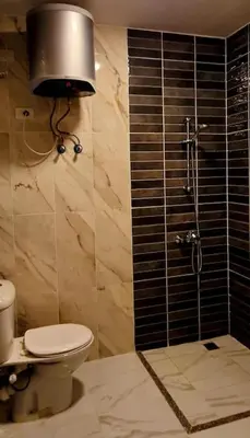 a bathroom with a toilet and a glass shower at Studio in Selena Bay Hurghada in Hurghada