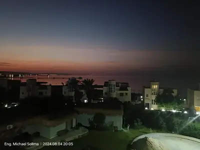 a view of a city at night at Fanadir sea view Appartment in Hurghada